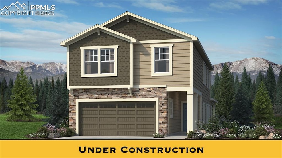 View of front of property with a garage, driveway,