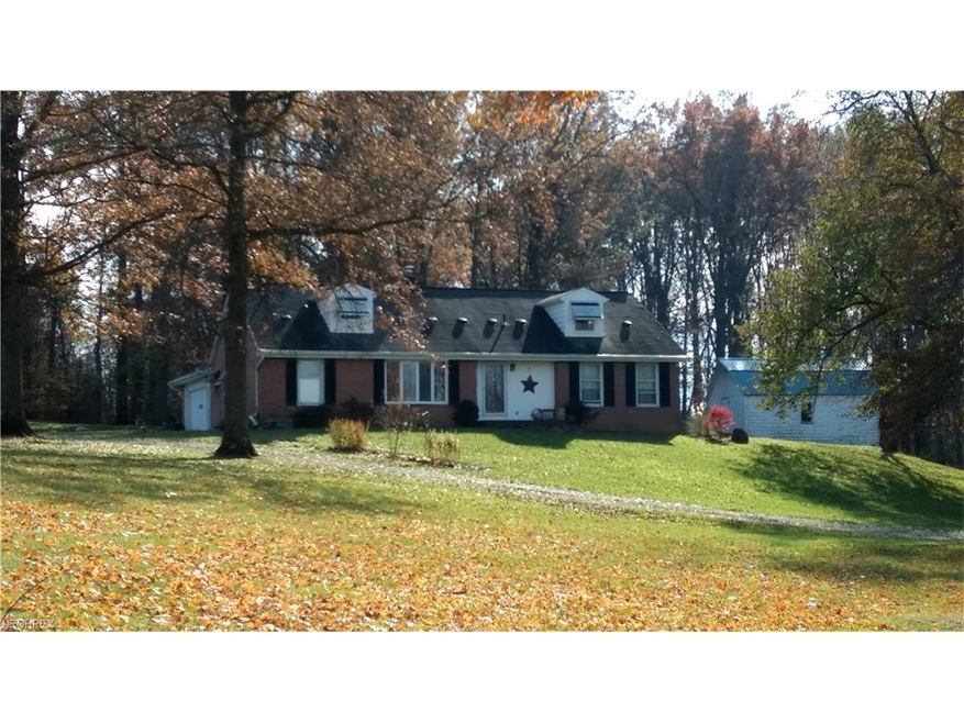 Exterior from close to the road. Notice the two le