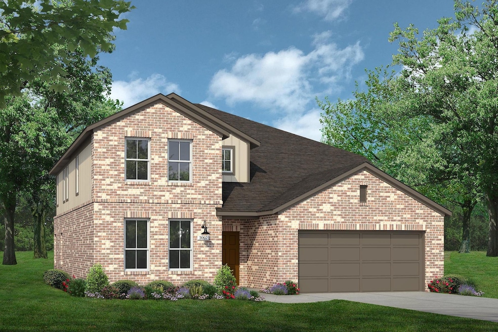 View of front facade featuring brick siding, an a