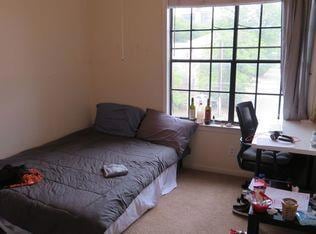 Bedroom featuring light colored carpet