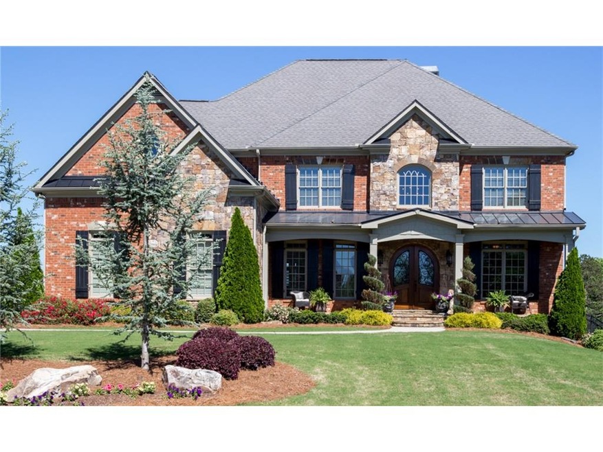 All brick & stone exterior, beautiful wood doors &