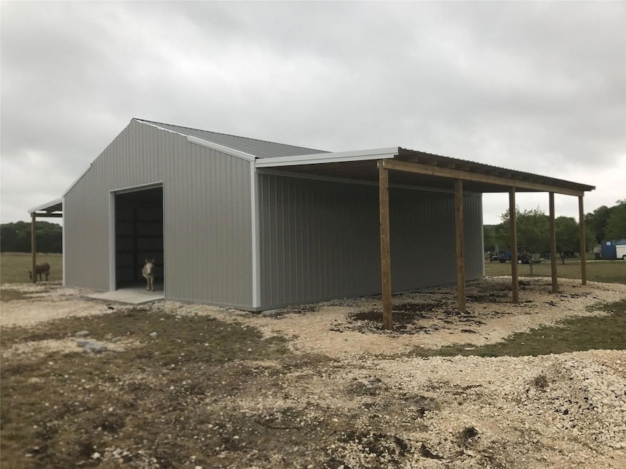 View of pole building featuring a carport