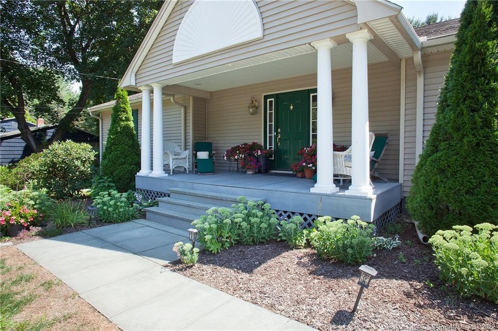 WOW.. Look at this welcoming front porch. Just bea