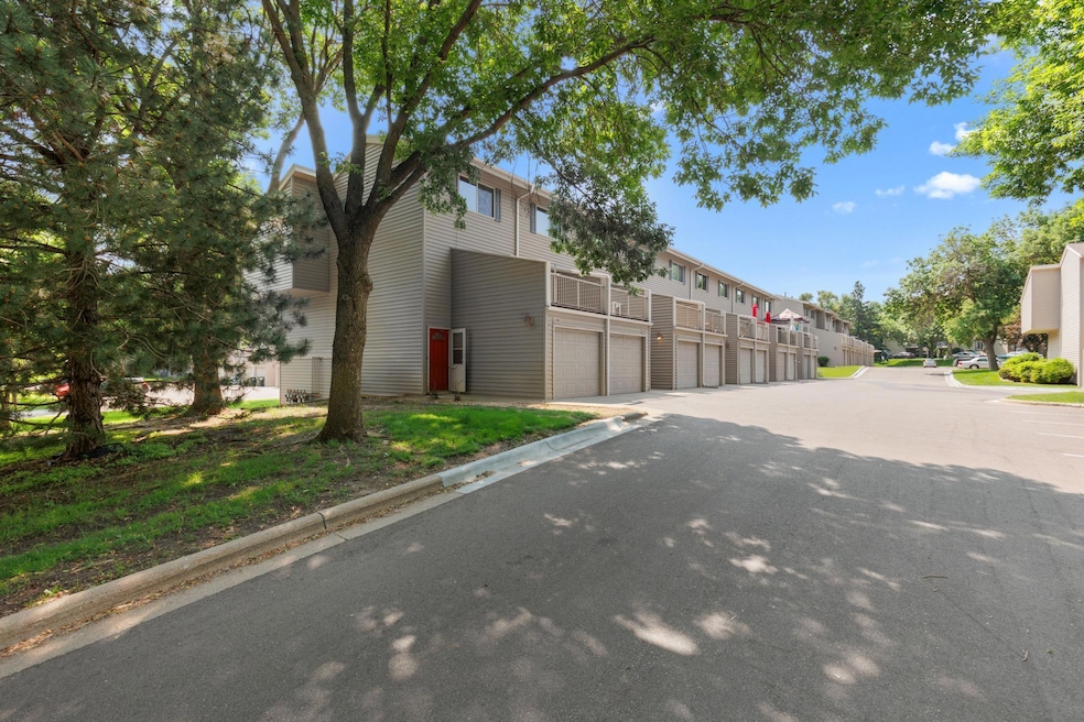 End unit with attached single garage and extra assigned parking space.