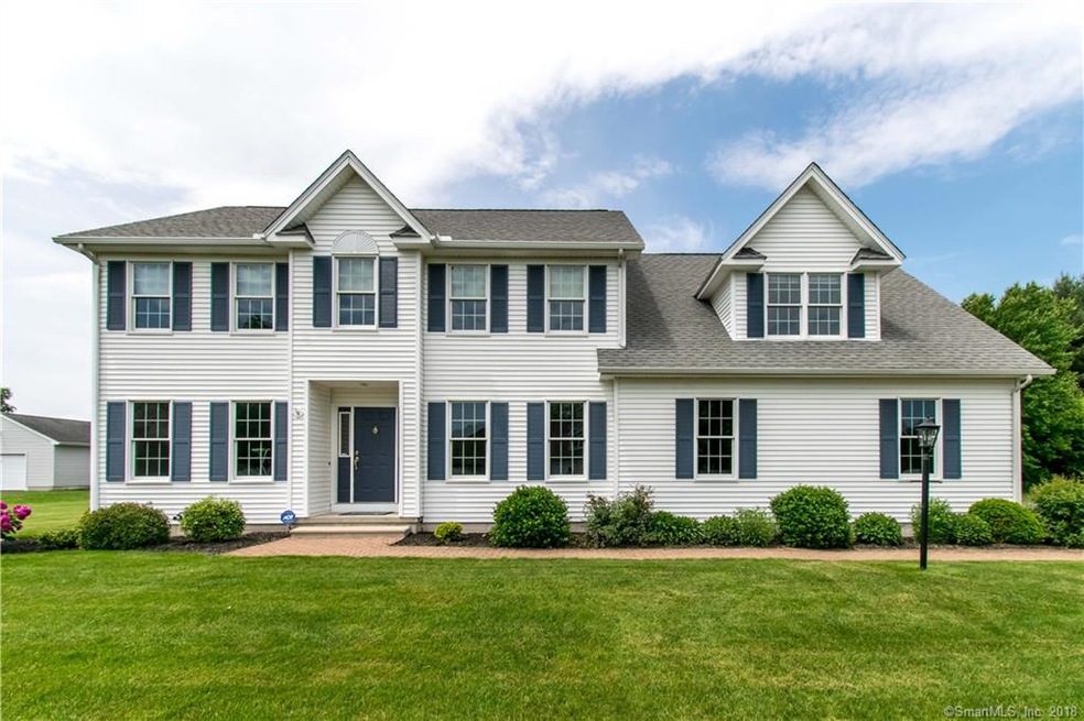 Custom built Colonial with side load garage