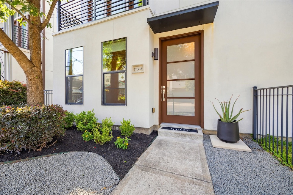 The pathway is elegantly landscaped with expanded