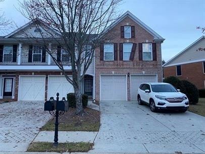 Traditional home featuring driveway and an attache