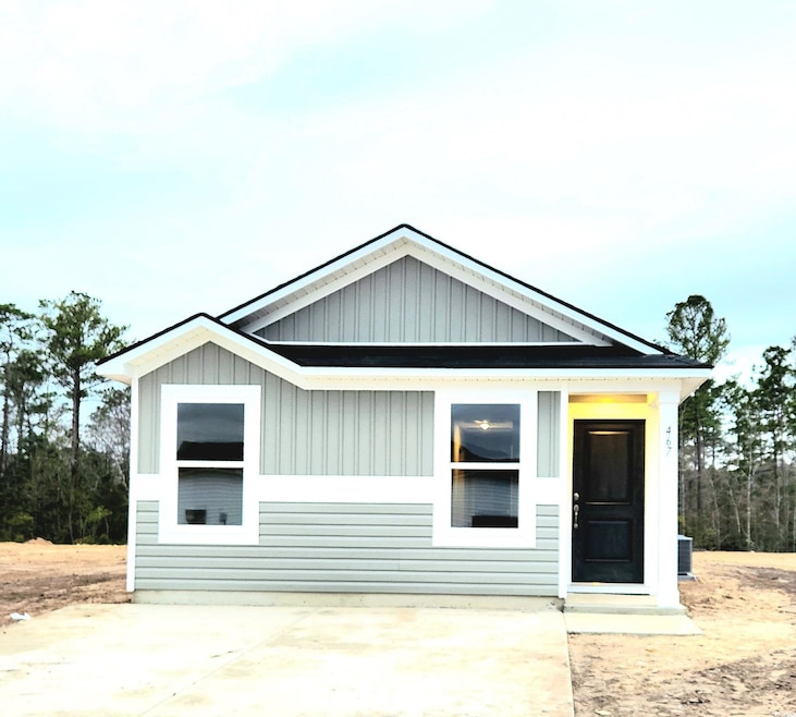 View of front of property with a patio and central