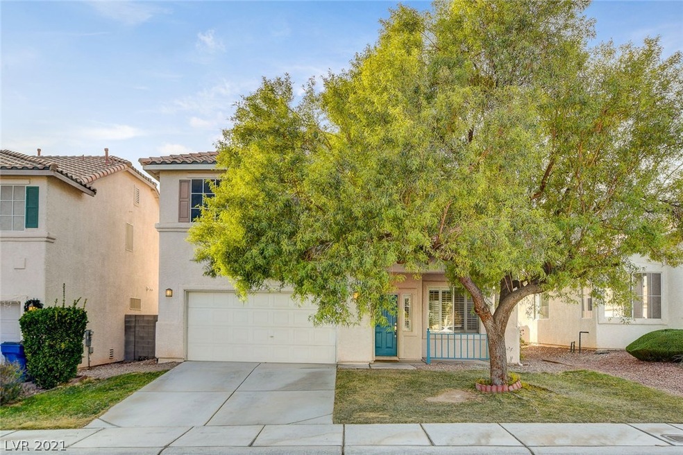 Front of home with big beautiful tree and porch