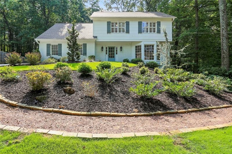 Picturesque setting framed among trees and profess