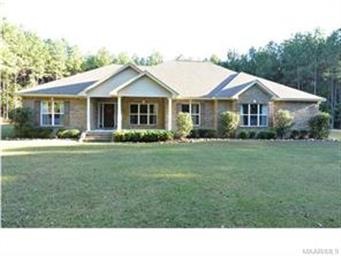 FRONT VIEW OF THE HOME AND 7.08 +/- ACRES.