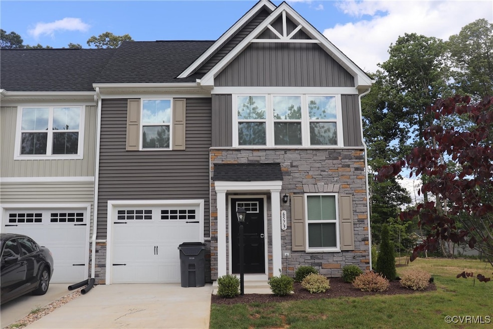 View of front facade featuring stone siding, concr