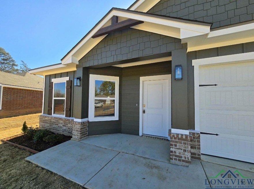 Doorway to property featuring a garage