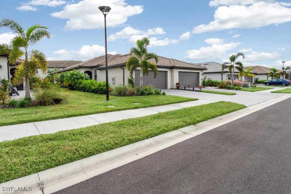View of front of house featuring a garage, stucco