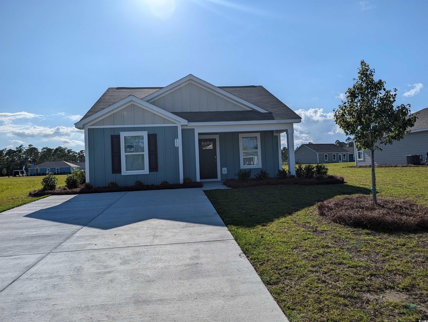 View of front facade with a porch and a front lawn