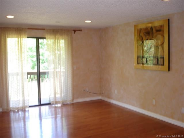 Large and sunny LIVING ROOM with a sliding door to