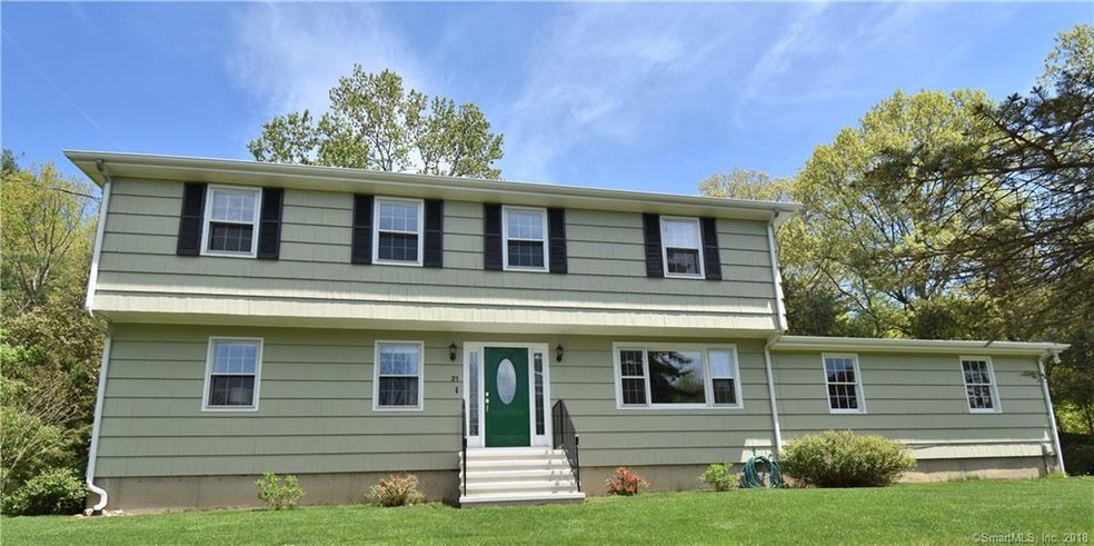 Truly a Terrific Tashua Center Hall Colonial await