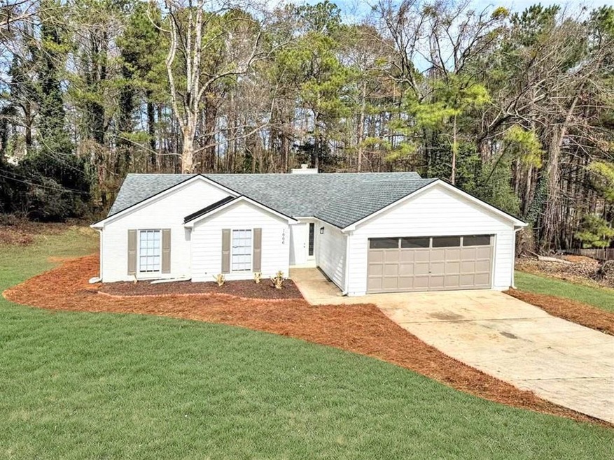 Single story home with an attached garage, concret
