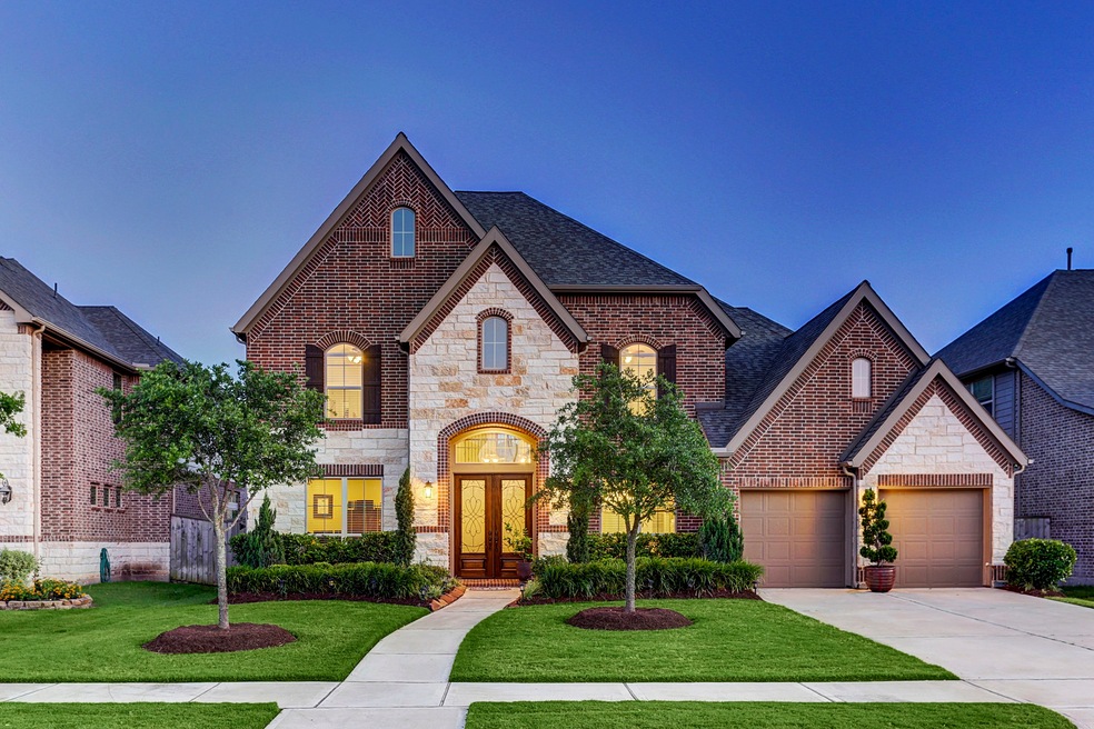 27827 BURCHFIELD GROVE LANE... Perry built recent construction with brick and stone elevation now available.  Property features mature landscaping, three car tandem garage, study, master plus one bedroom down, gameroom, media room and covered patio.