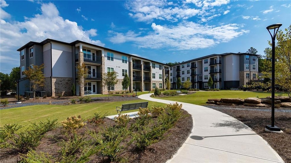 View of property's community featuring a yard