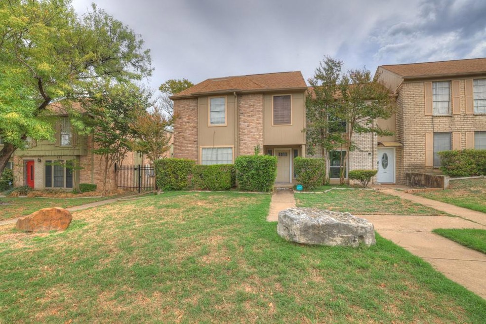 View of front of property with a front yard and b
