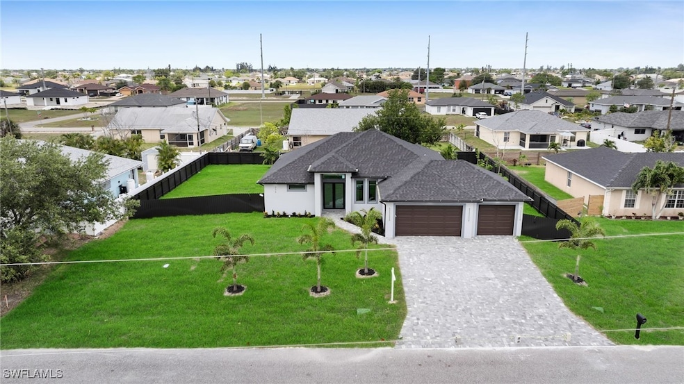 View of front of house with a garage, a residentia