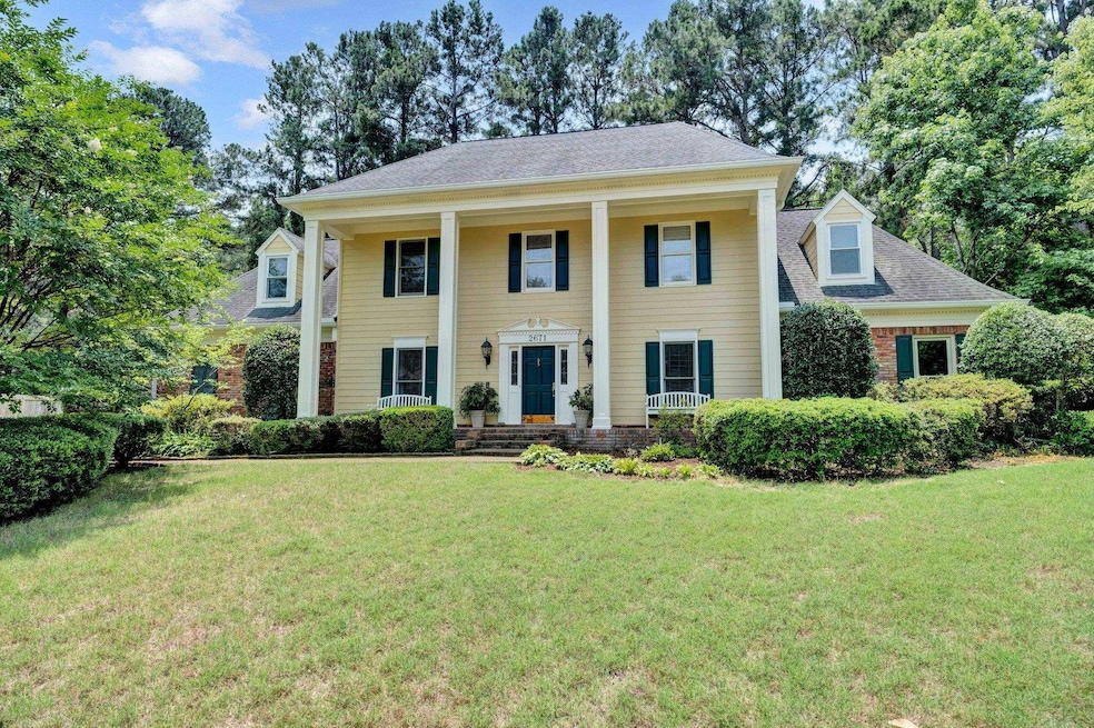 Neoclassical house featuring covered porch