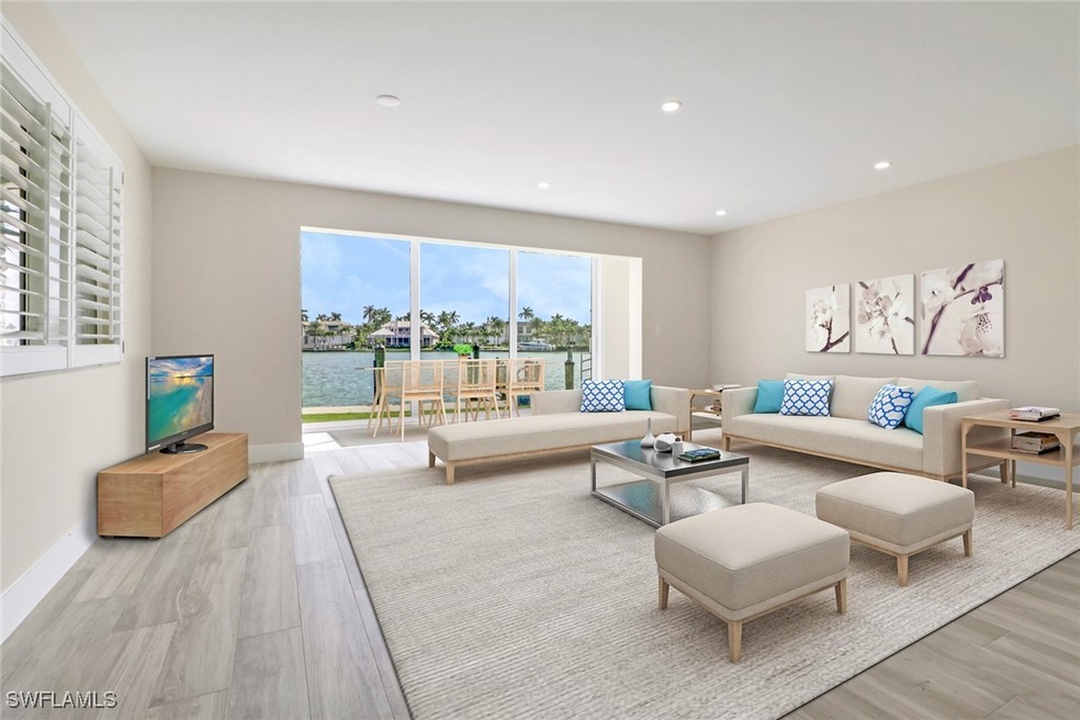 Living area with recessed lighting and light wood-style flooring