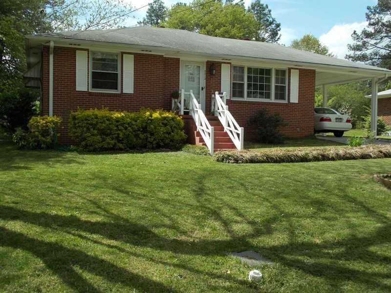 Exterior Front. Charming four-sided brick bungalow