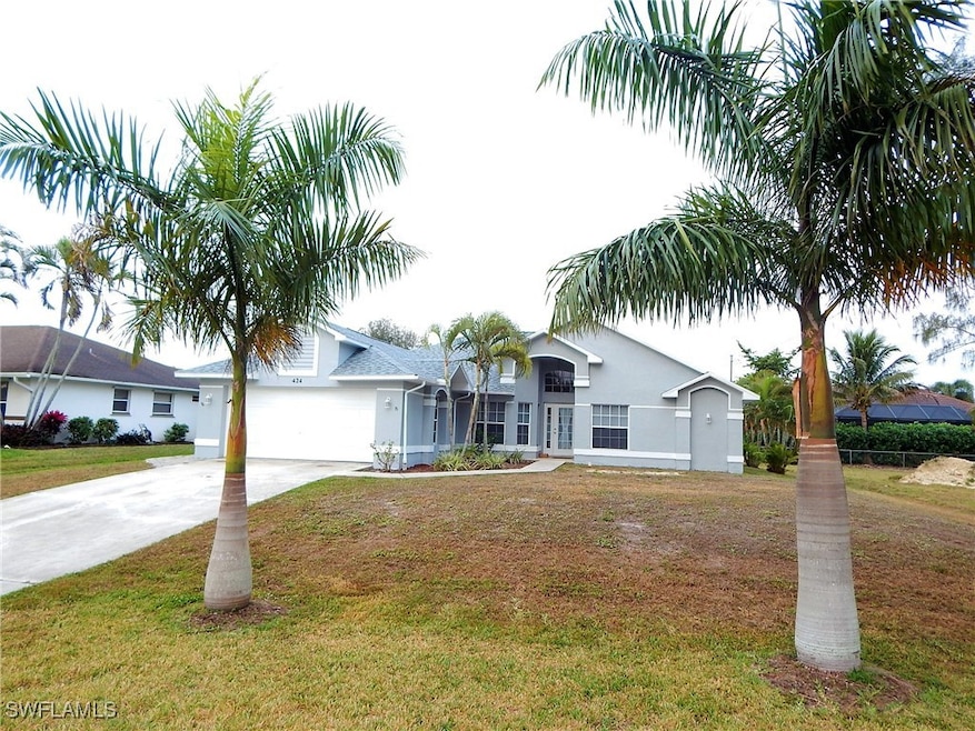 Ranch-style home featuring concrete driveway, a fr