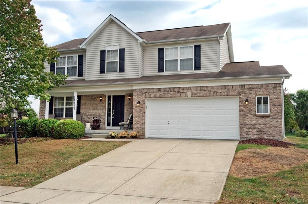 Front of Home has Brick, Freshly Painted Trim, and shows large garage bump-out which is great for storage.