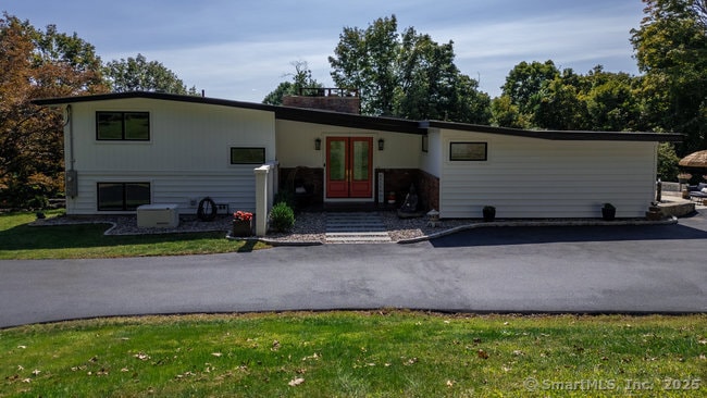 Welcome to 145 Pine Hill Rd. This is a split-level home offering Foyer/LR/DR/Kitchen/Primary Bedroom Suite/Laundry Room on Main Level, with 6 steps up to 2 Bed/1 bath and 6 steps down for an add'l bed/office/bath. Lower Level 6 steps down to FR/Pool.