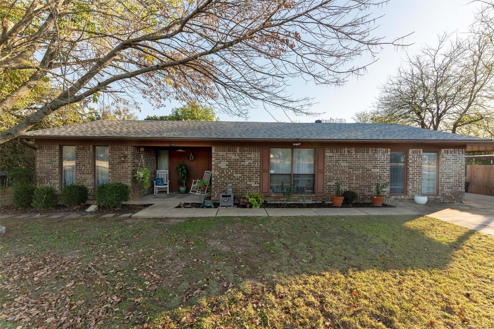 Back of property featuring a yard and a patio area