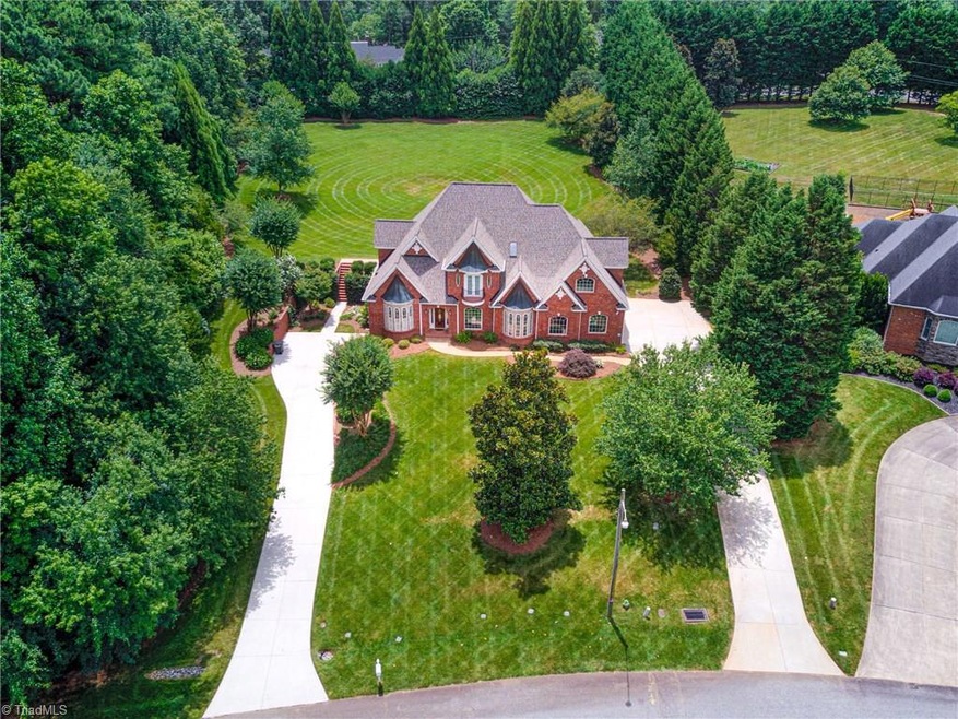 Notice the two driveways affording the comfort of a two car attached garage and a two car tandem garage on the lower level.