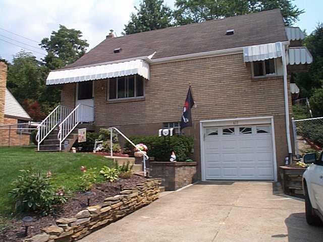 Exterior Front. What a wonderful find!!  This one and a half story home has two bedrooms and two full baths.  There is a concrete driveway leading to a one car garage.