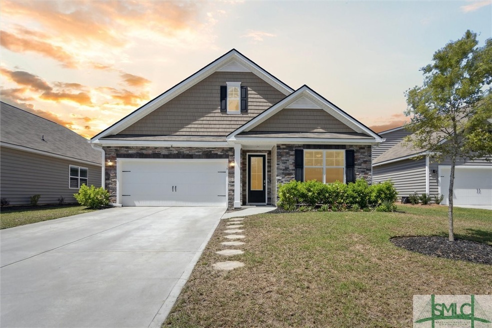 Front exterior view with thoughtful landscaping