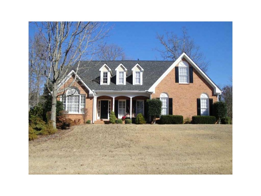 Exterior Front. Three sides Brick home with side e