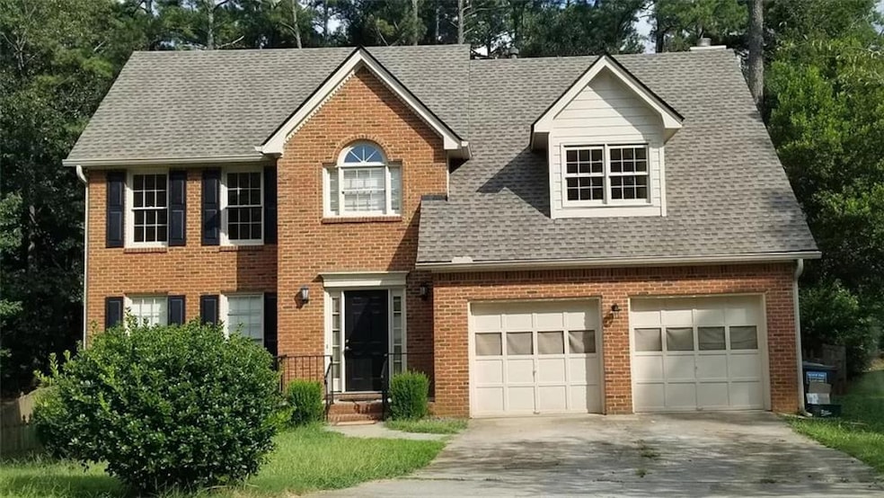 View of front of property featuring a garage