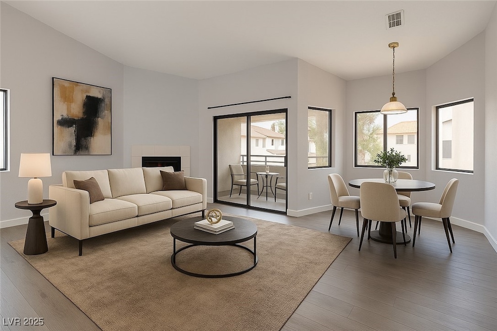 Living area featuring baseboards, wood finished fl