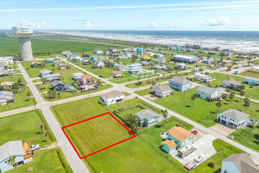 A flat, well-maintained grassy lot with easy acces
