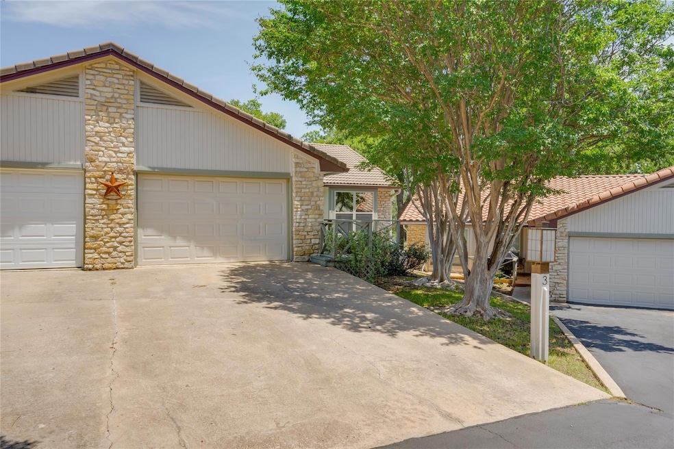 Mid-century modern home with a tiled roof, stone 