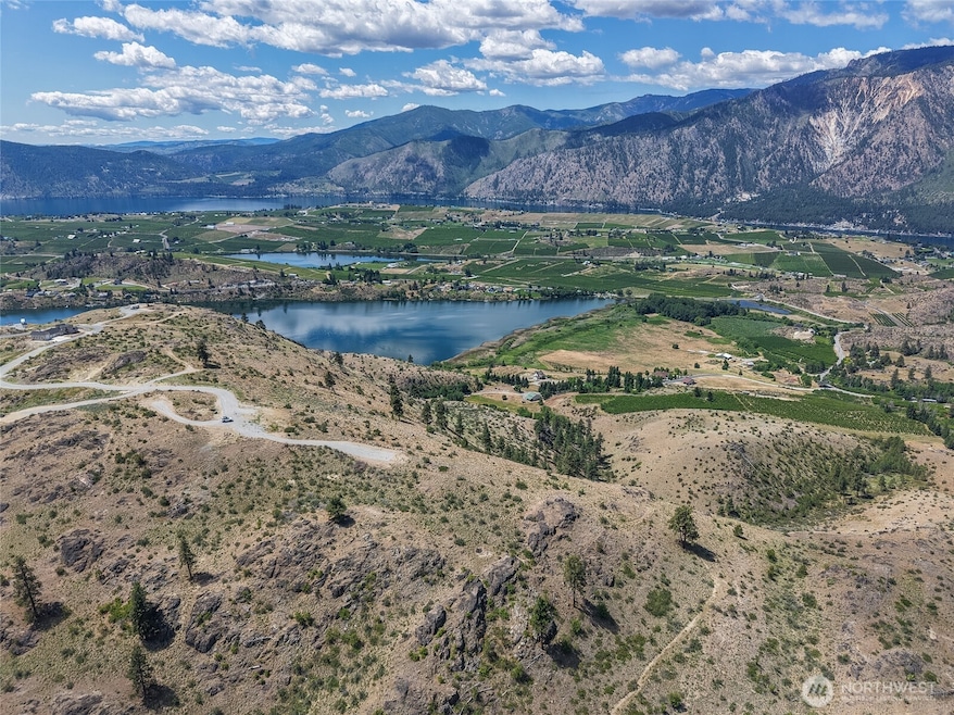 Just shy of 8 acre lot with beautiful views of Lake Chelan, Wapato Lake, Dry Lake and Roses Lake