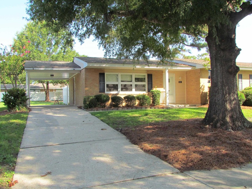 Single story home with a carport