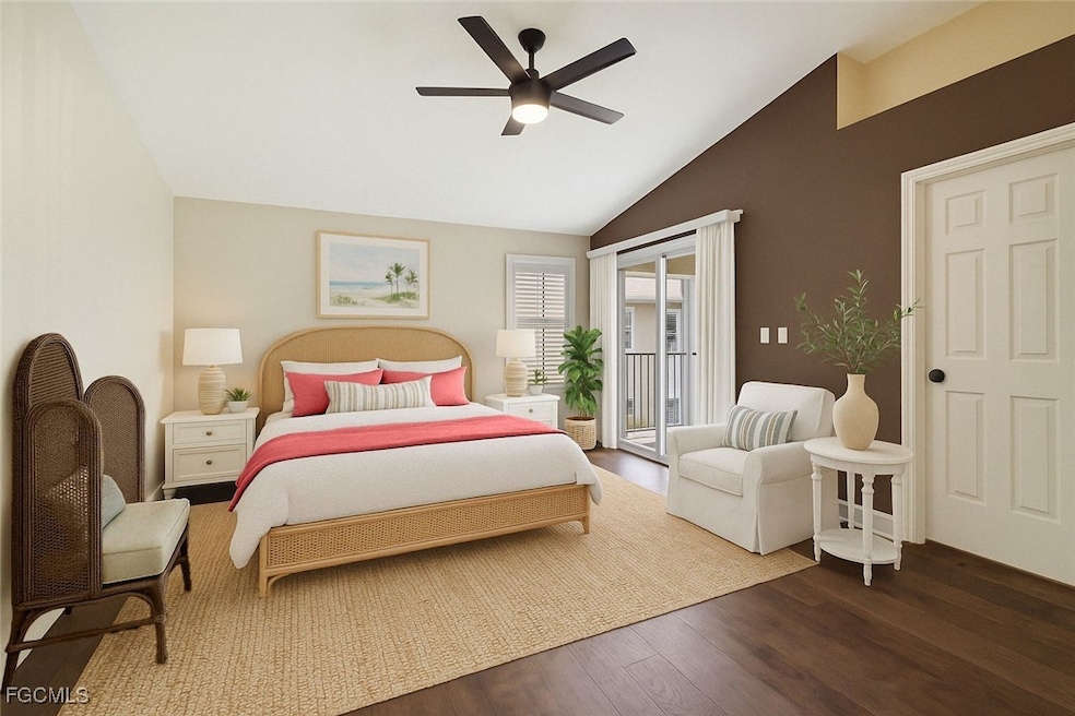 Bedroom with wood finished floors, lofted ceiling, access to exterior, and a ceiling fan
