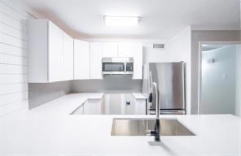 Kitchen featuring appliances with stainless steel 