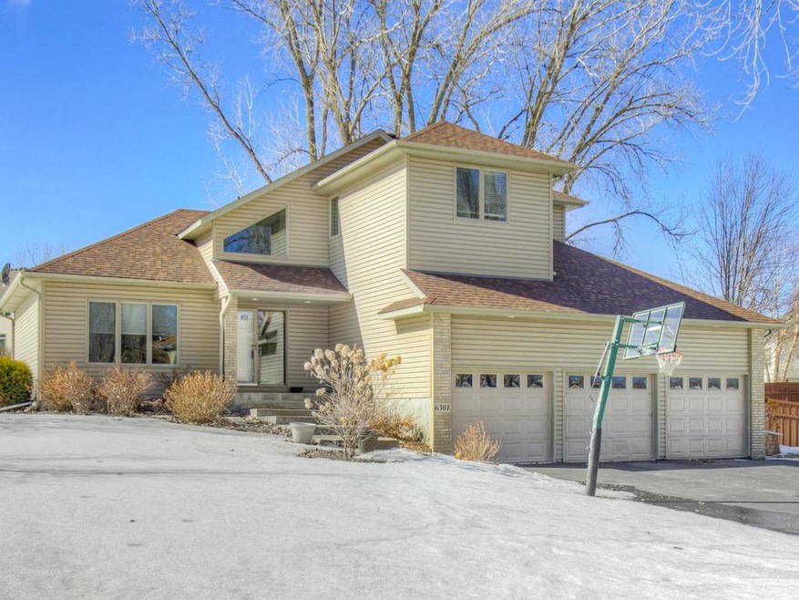 6301 Balsam Ln N. is situated on a beautiful corne