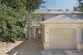 View of front of property with concrete driveway,