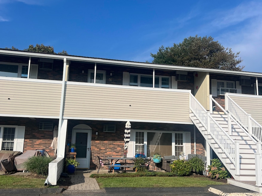 Ground level unit F. No steps to unit, front patio or parking lot.