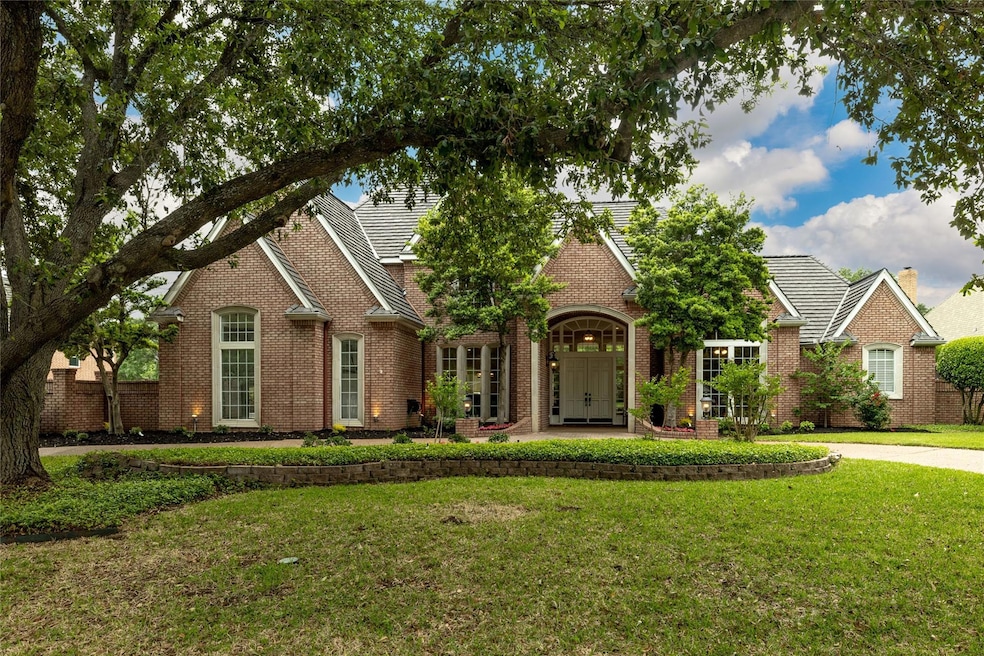Gem in Colleyville! Over 100 year old oak tree graces the circular driveway, on over half acre lot!