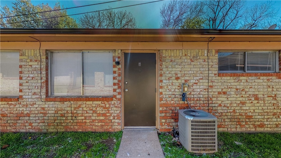 Doorway to property with central air condition uni
